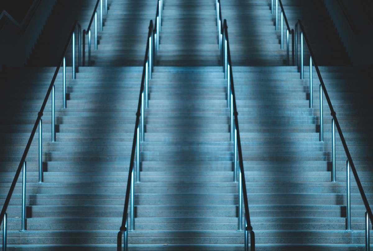 blue empty concrete stairs with metal handrail san diego